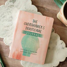 The Overthinker's Devotional Journal, front cover on marble tray