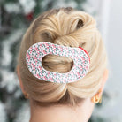 Teleties Festive Feels Large Flat Round Hair Clip holding a blonde twisted updo