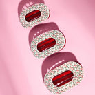 Teleties Festive Feels Flat Round Hair Clips in three sizes on pink, medium in center