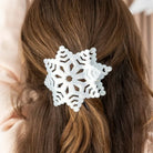Teleties glitter snowflake flat hair clip worn in long brown hair, back view