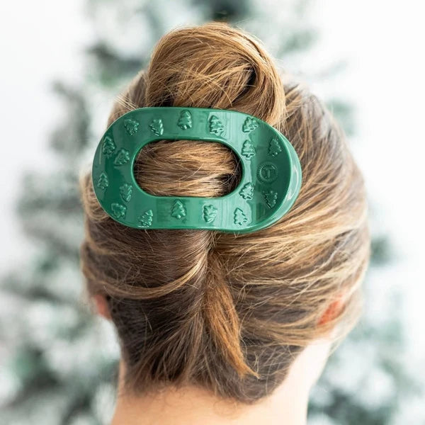 Teleties O Christmas Tree Large Flat Round Hair Clip in green holding a twisted updo