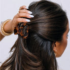 Teleties Open Petite Claw Clip in tortoise worn in dark half-up hair