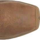 Close-up of a brown leather boot or shoe showing the vamp and decorative embossed pattern on a white background.