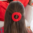 Teleties Medium Flat Circle Hair Clip in Red Carpet Ready red worn in half-up hair