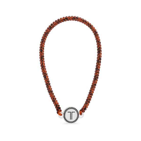 Teleties Spiral Hair Coil Headband in tortoise laid flat with logo charm