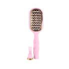 Teleties full size Vented Brush in Bubblegum Pink, bristle side with cleaning tool