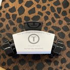 TELETIES Black Nonbreakable Claw Clip with logo card on a leopard print background